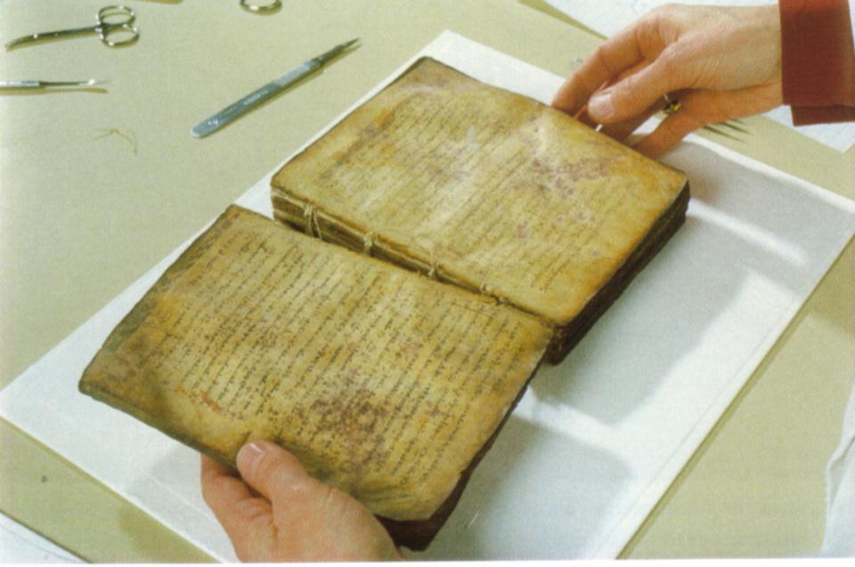 Separating the pages of the Archimedes Codex.